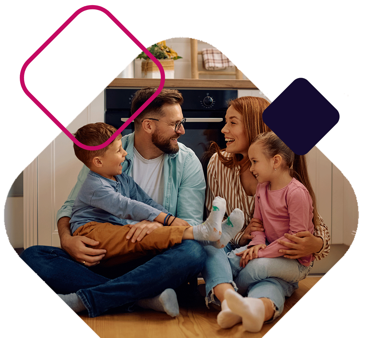 Family Sitting On Floor In Kitchen