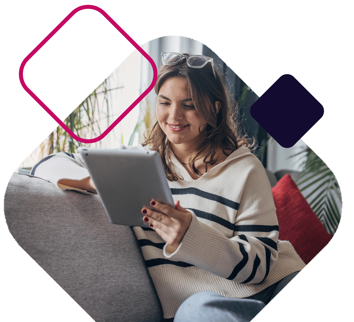 Woman Sitting On Couch Looking At iPad
