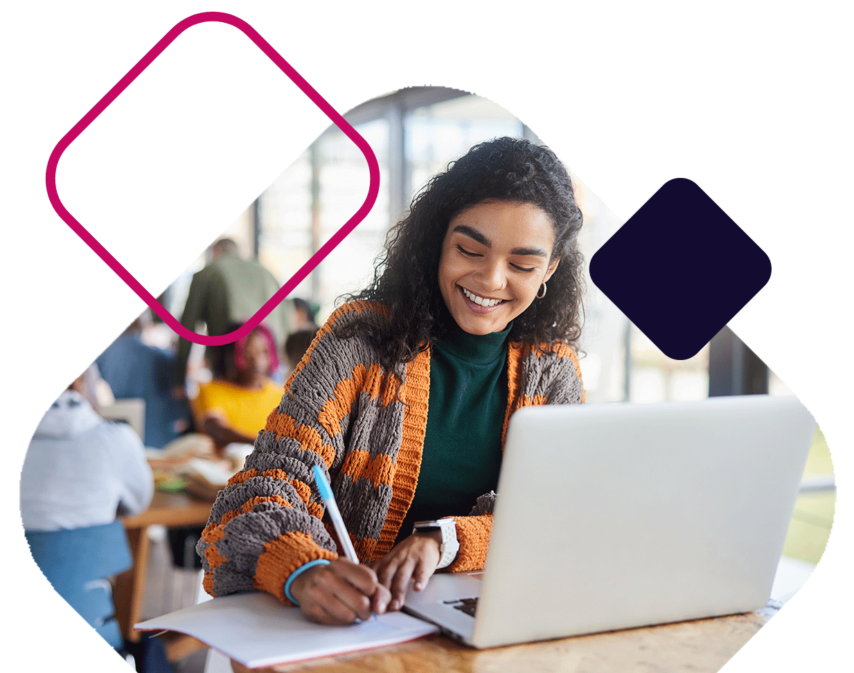 Smiling Student Writing In Notebook With Laptop
