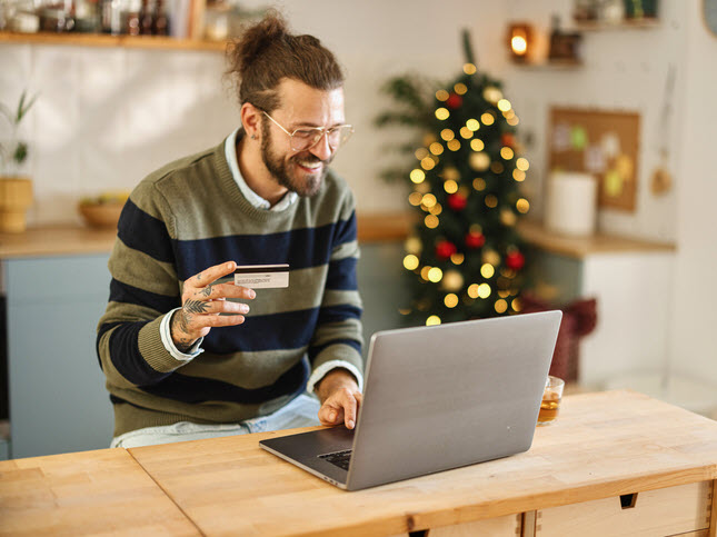 Man With Credit Card And Laptop