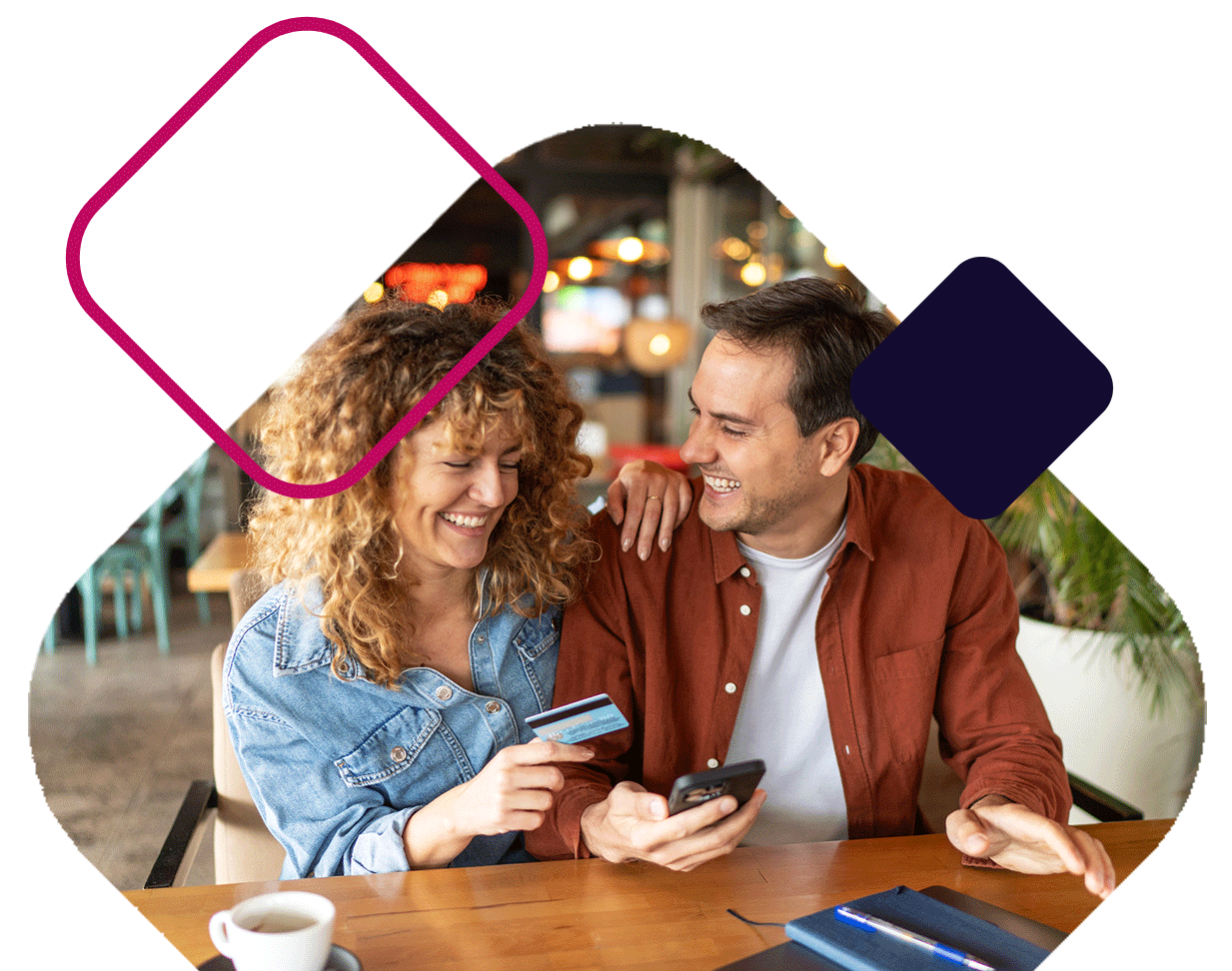 Couple Holding Card And Phone