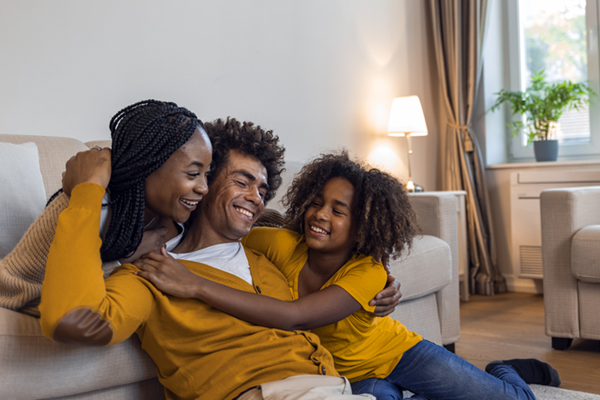 Smiling Family At Home