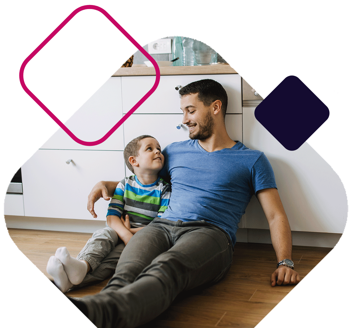 Dad And Son Sitting In Kitchen