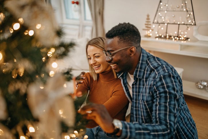 Couple By Holiday Tree