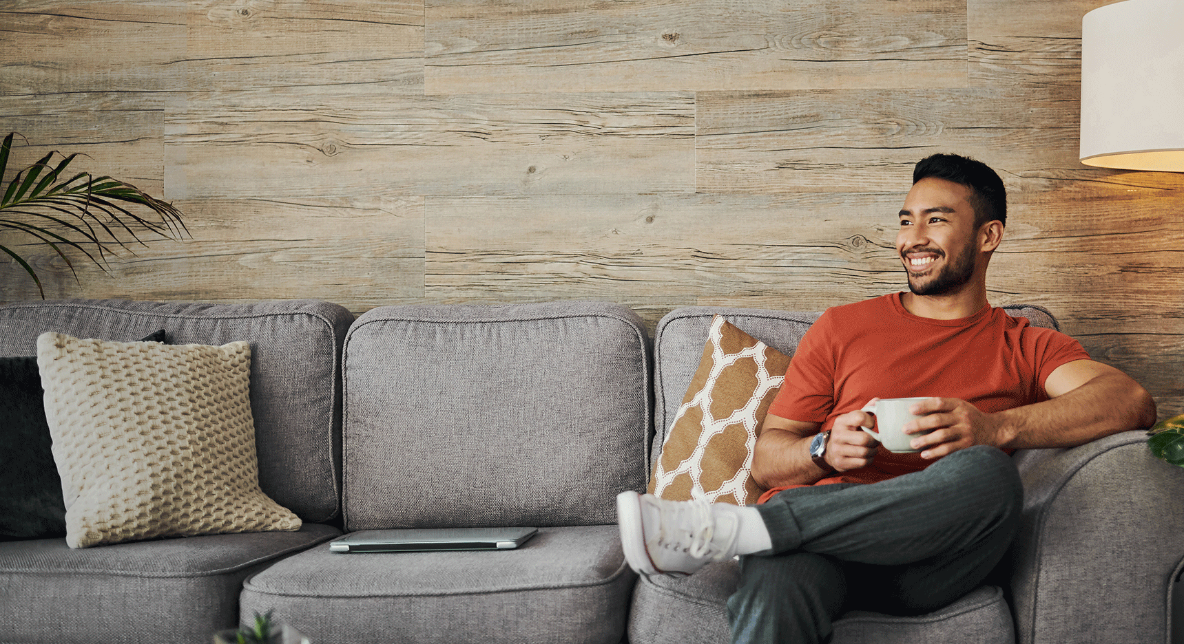 Young Man Sitting On Couch