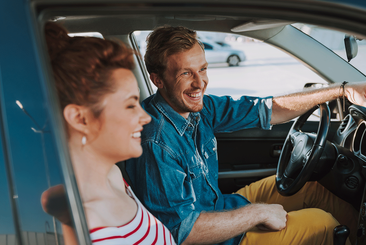 Cheerful-Man-Sitting-In-Car
