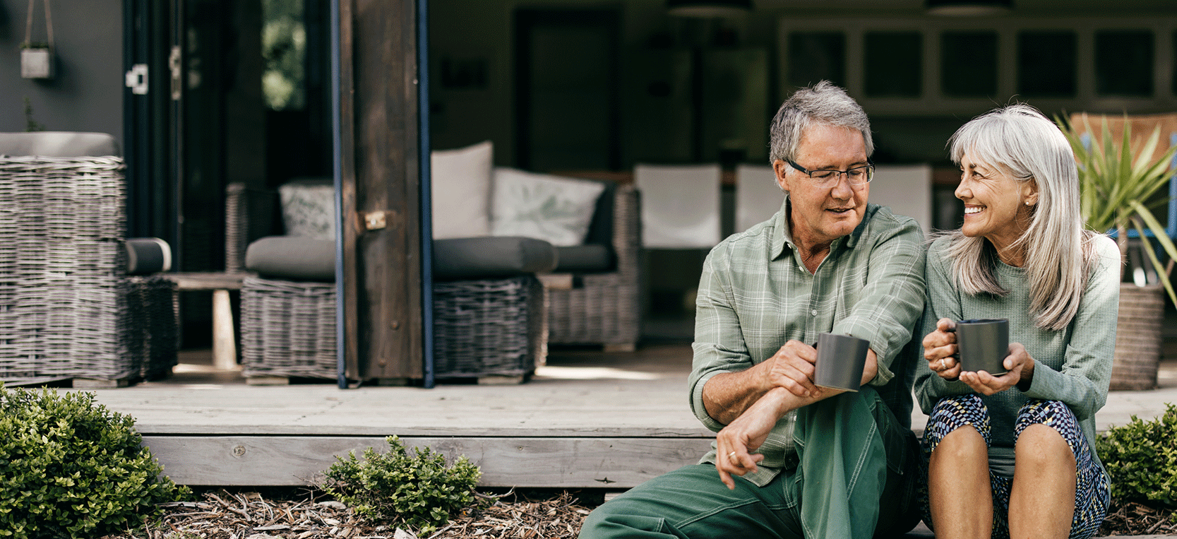 Older Couple Having Coffee Outside