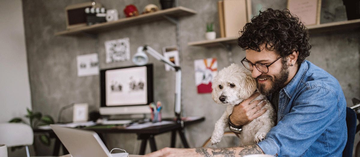 Man Holding Small White Dog