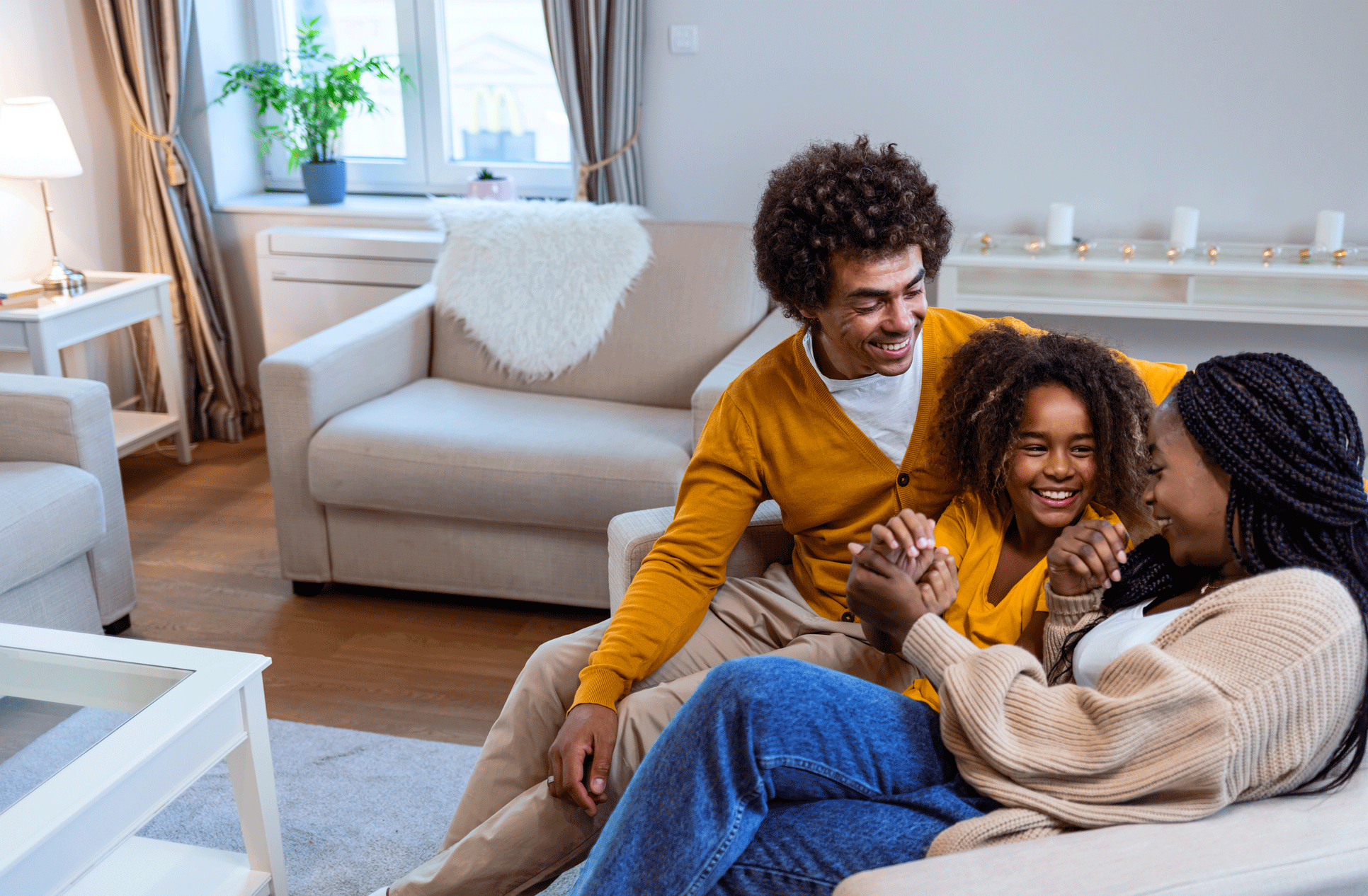Smiling Family In Living Room