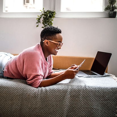 Woman on couch looking at phone