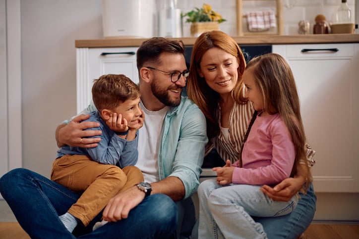 Family Smiling in the Kitchen