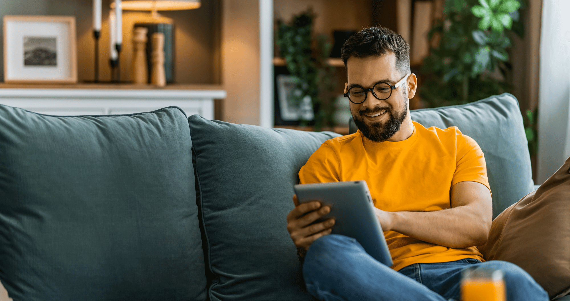 Man using tablet at home