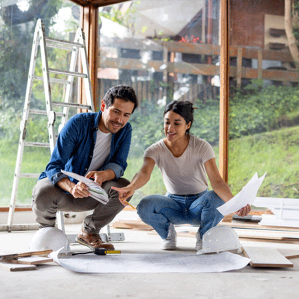 Couple looking at renovation plans