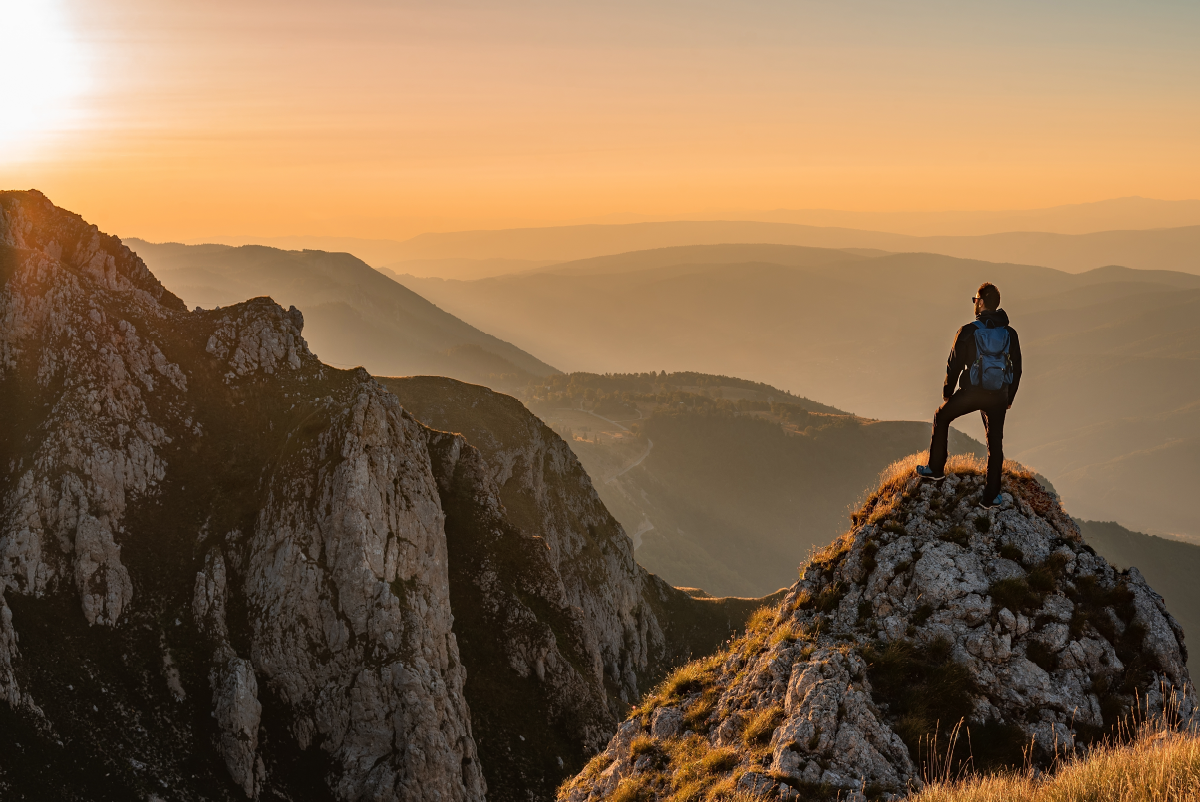 Man standing on mountain top