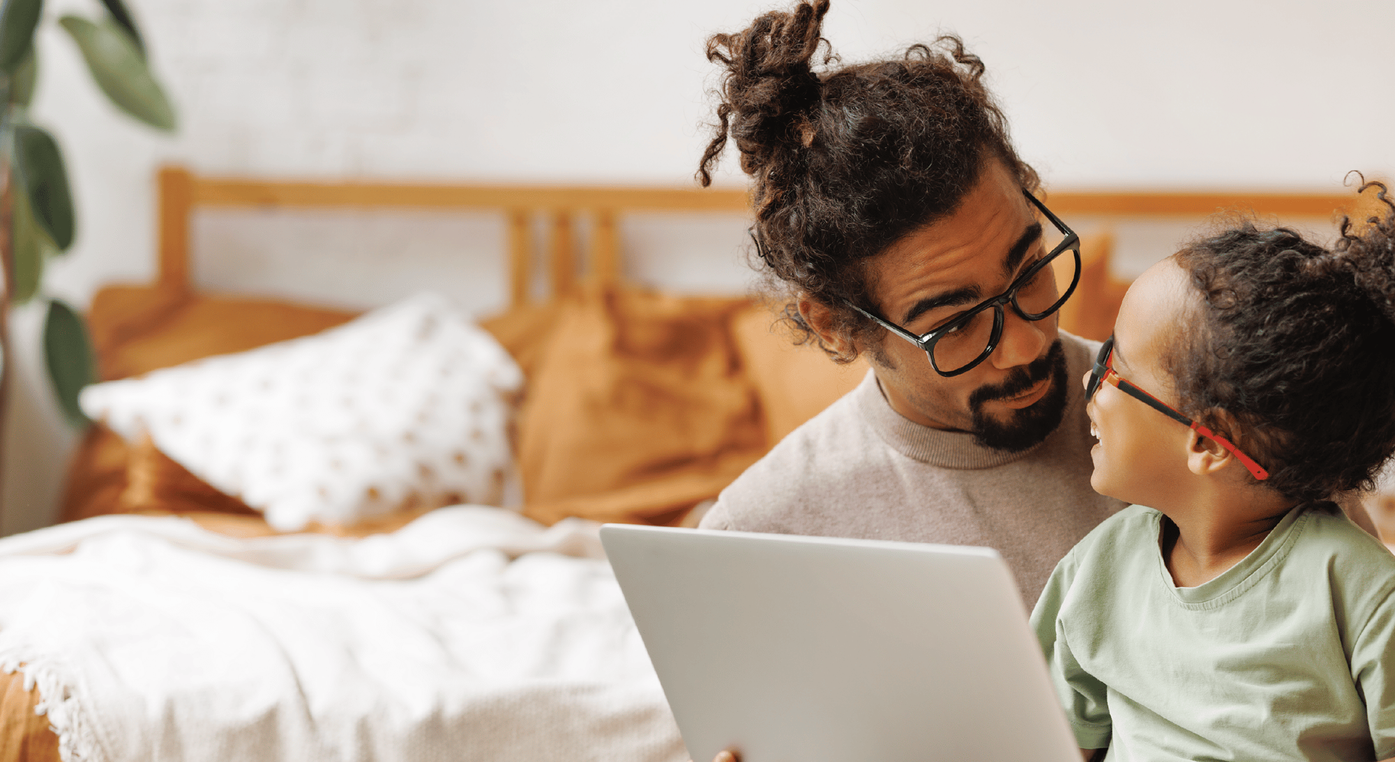 Father and daughter looking at laptop