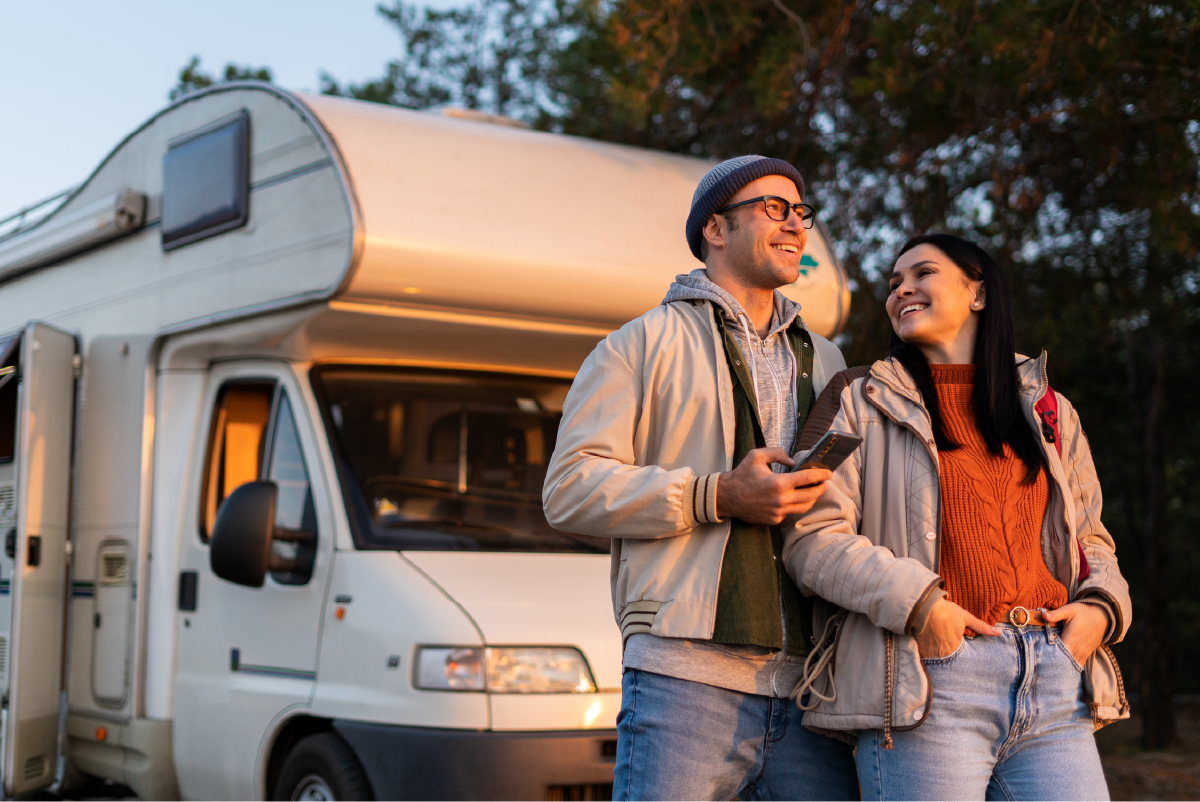 Couple outside of recreation vehicle