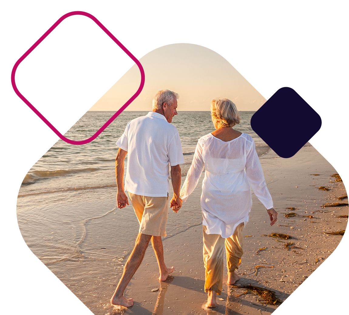 Senior couple walking on the beach