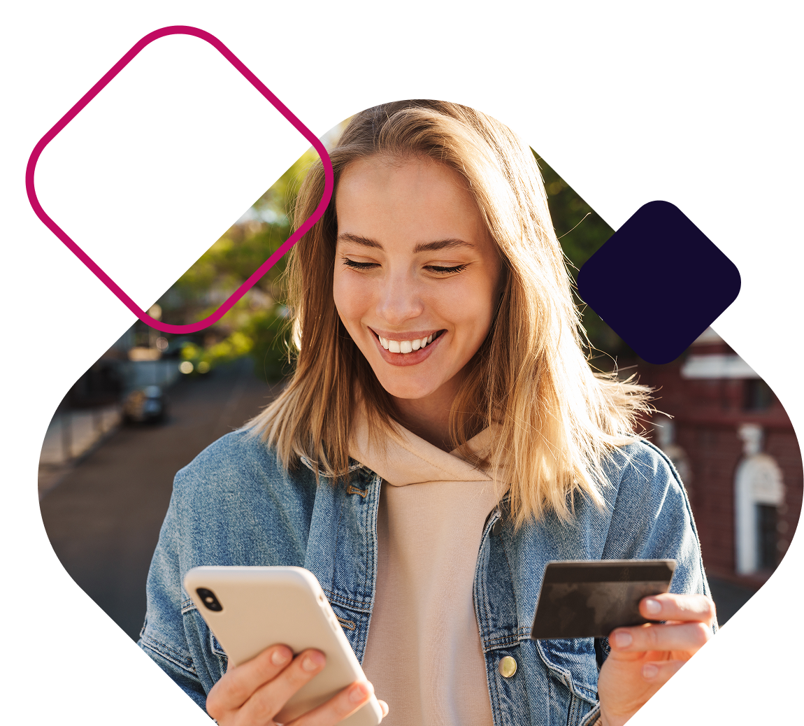 Woman holding credit card and cellphone