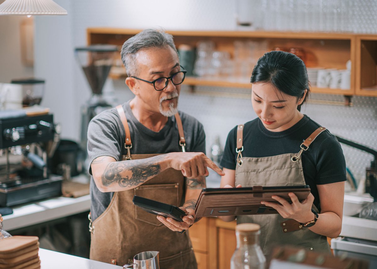 Asian Business owners Using Tablet