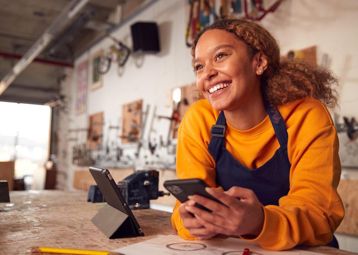 Female Workshop Worker On Phone