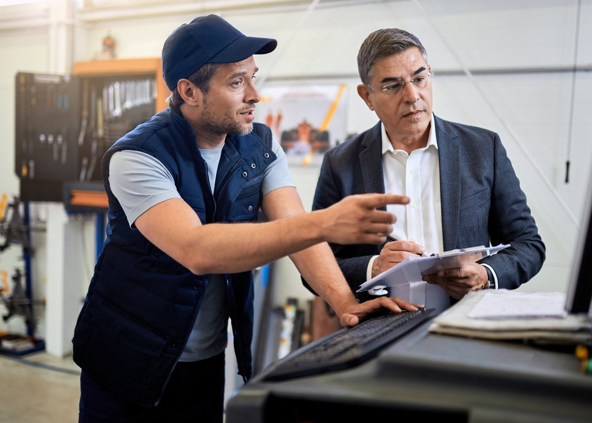 Mechanic talking with lender