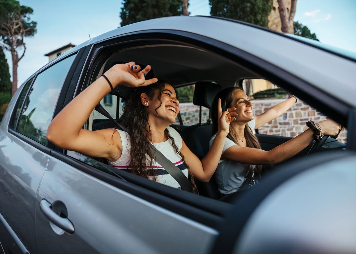 Two Friends Riding In Car