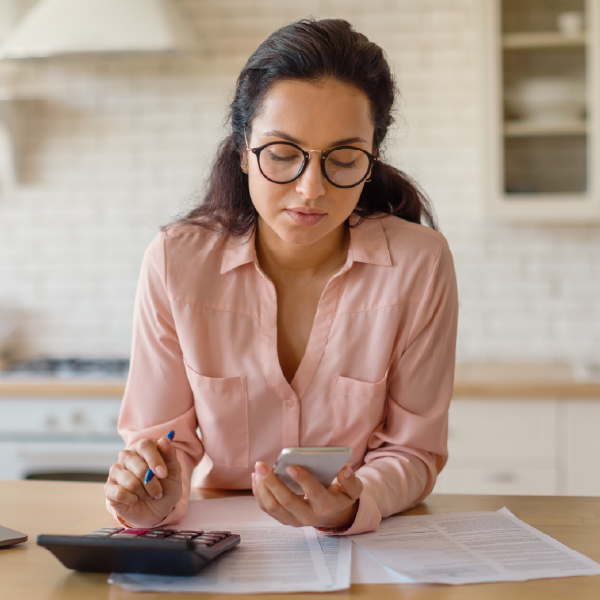 Woman using calculator