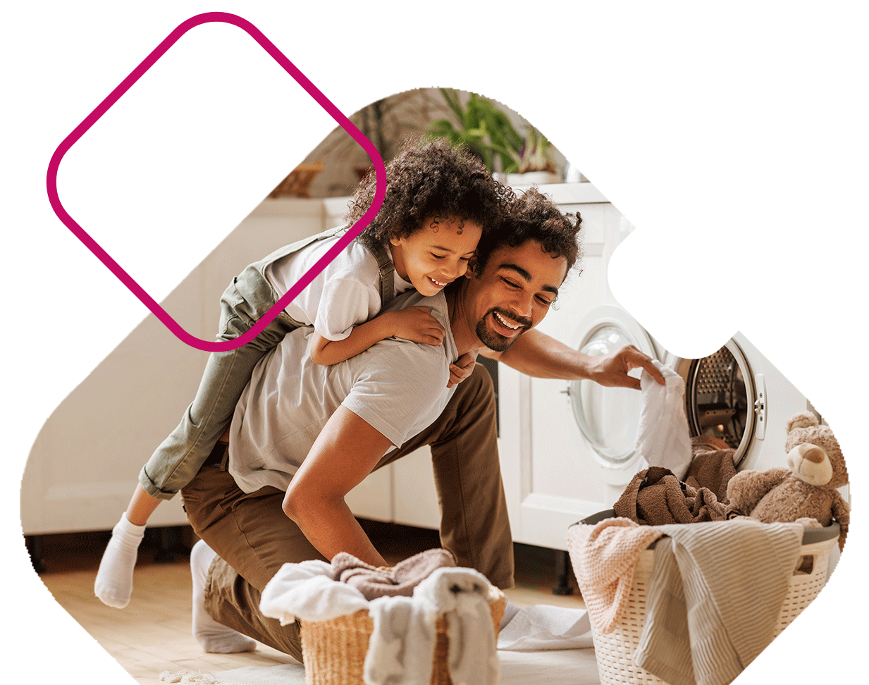 Dad doing laundry with kid on back